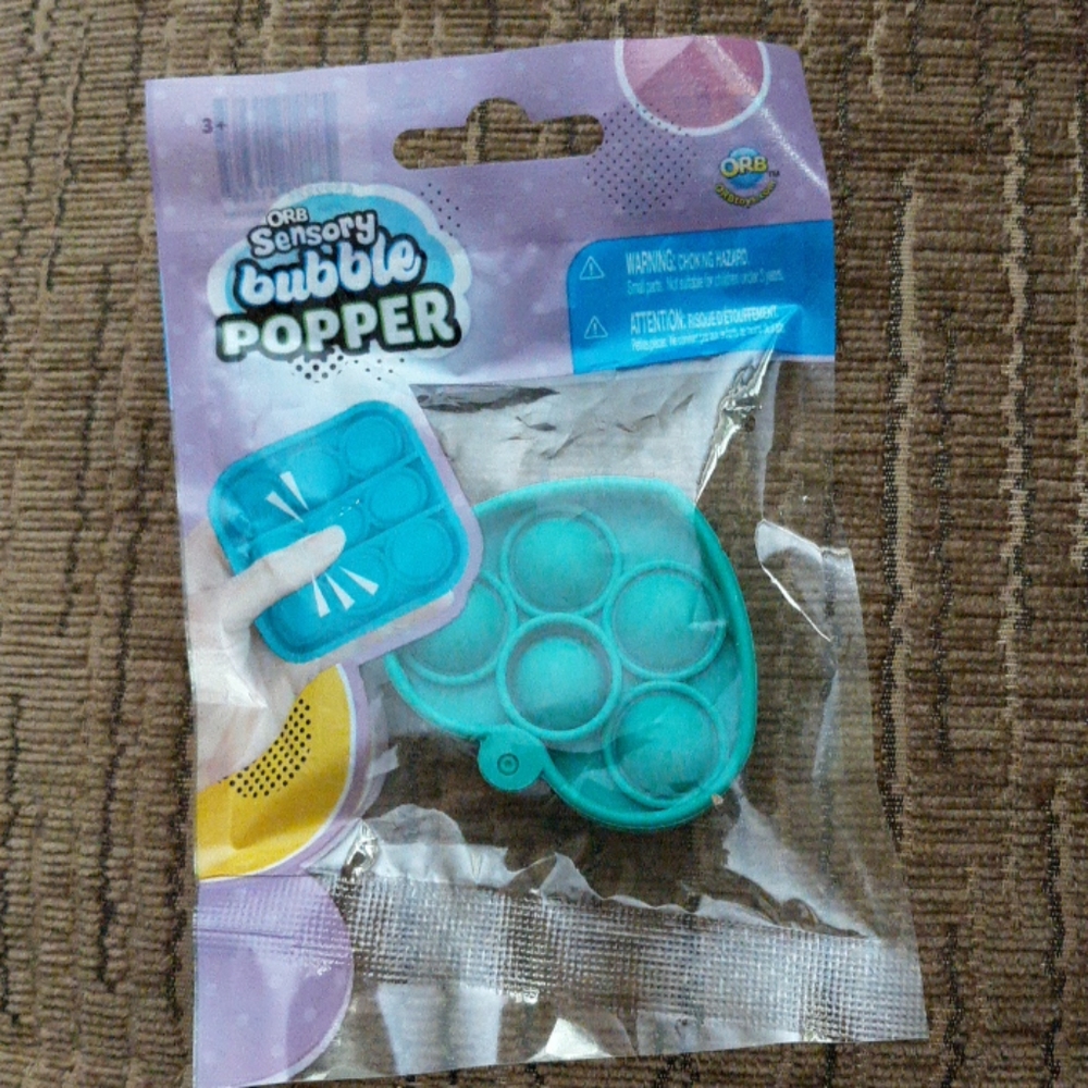 #678 NWT ORB Sensory bubble mini popper. Aqua heart